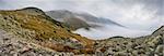 Mountains Landscape with Fog in Ziarska Valley. Rocks in Foreground.