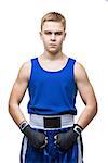 Young handsome boxer sportsman in blue boxer suit and black gloves standing on white backgound. Isolated. Copy space.