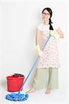 Young Asian woman mopping floor with water, home cleaning.