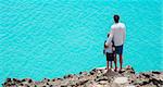 panorama of father and son enjoying beautiful anguilla island at caribbean