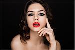 Beauty black stripes  eyes and red lips makeup  on black background