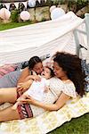 Mother Plays With Daughters In Garden Den From Above