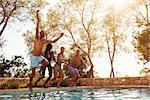 Friends On Vacation Taking Selfie Of Jumping Into Pool