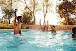 Friends On Vacation Taking Selfie Of Into Outdoor Pool