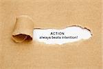 Quote Action Always Beats Intention, appearing behind ripped brown paper.