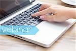 Virtual learning webinar concept - hand tounching laptop keyboard