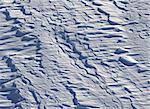 Off-piste slope after snowfall in ski resort at sun winter day. Natural background.