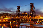 Traffic Light Trails on Steel Bridge over Willamette River in downtown Portland Oregon during blue hour