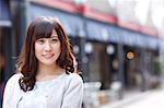 Fashionable Japanese woman at a traditional shopping street, Tokyo, Japan