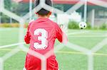 Japanese kid playing soccer