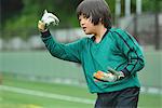 Japanese kid playing soccer