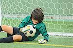 Japanese kid playing soccer