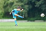 Japanese kid playing soccer