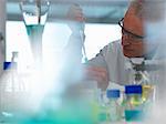 Life Science, Scientist pipetting a sample in a eppendorf vial during an experiment in the laboratory