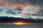 Sunset over icebergs in Lemaire channel, Antarctica