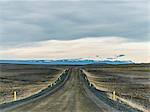 Distant mountains and dirt track road, Reykjahlid, Iceland