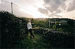 Woman looking out over vineyard  landscape