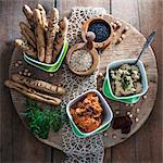 Vegan herb hummus and tomato hummus with sesame sticks