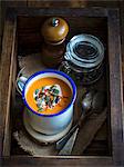 A bowl of vegan pumpkin soup with coconut milk and saffron