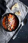 Tomato soup with farro, carrot and parmesan cheese