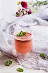 Juice of watermelon and orange and pineapple topped with fresh mint