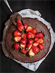 Paleo (floverless and gluten free) chocolate cake with strawberries