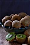Kiwis in and next to a fruit bowl