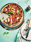 Tomato tart with olives, parmesan and basil