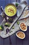 Creamy broccoli soup with pine kernels and croutons