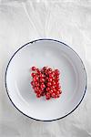 Redcurrants in an enamel bowl