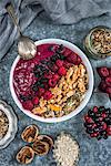 Mixed berry smoothie bowl with walnuts and seeds