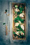 Broccoli, bimi and cauliflower tarte, almonds, fresh thyme and fresh basil leaves