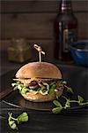 Vegeterian burger with mushrooms, pea shoots, pesto, onions and mature chedar cheese
