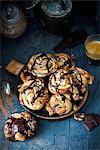Swirl buns with a chocolate and cinnamon filling, chocolate sauce and walnuts