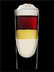 A layered drink with eggnog against a black background