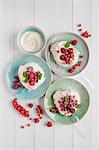 Meringue with whipped cream, berries and mint