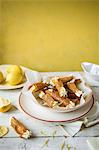 Brandy snap tuilles with lemon cream in a bowl.