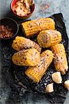 Grilled corn on the cob with herb butter and Parmesan