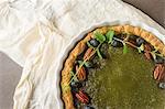 Green tea vegetarian pie match with nuts and mint