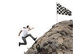 Businessman climbs a mountain to get to the flag. Achievement business goal and Difficult career concept