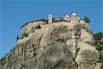 Low angle view of Varlaam Monastery on rock formation, Meteora, Thassaly, Greece