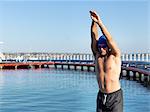 Swimmer diving from boardwalk, Eastern Beach, Geelong, Victoria, Australia