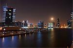 Cityscape at night showing Dubai Canal, Dubai, UAE