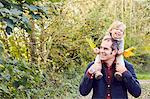 Father carrying daughter on shoulders