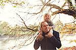 Father carrying daughter on shoulders