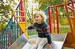 Girl on playground slide