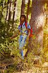 Young woman, hiking through forest, Cape Town, South Africa