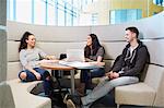 University students relaxing in modern seating area