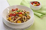 Pasta with colourful tomatoes, pine nuts and fresh oregano