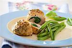 Chicken breasts filled with spinach served with green beans